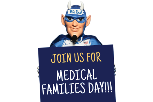 Duke Blue Devil Holding a Medical Families Day sign